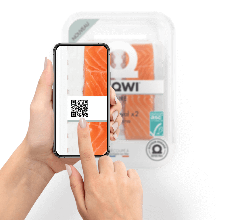 A hand holds a phone to scan a QR code on a package of salmon.